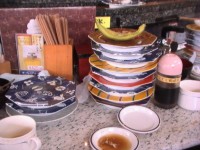 寿司を12皿食べました。 寿司を12皿食べました。